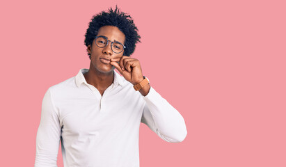 Handsome african american man with afro hair wearing casual clothes and glasses mouth and lips shut...