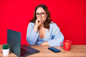 Young beautiful caucasian woman working at the office with laptop feeling unwell and coughing as symptom for cold or bronchitis. health care concept. - obrazy, fototapety, plakaty
