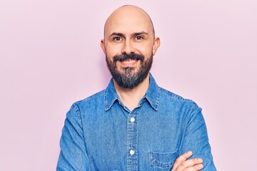 Young handsome man wearing casual clothes happy face smiling with crossed arms looking at the camera. positive person.