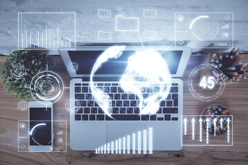 Multi exposure of financial chart drawing over table background with computer. Concept of research and analysis. Top view.