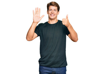 Fototapeta premium Handsome caucasian man wearing casual clothes showing and pointing up with fingers number six while smiling confident and happy.