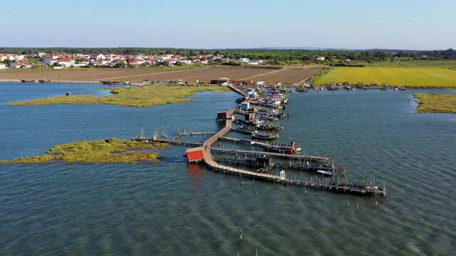 Aerial View of Carrasqueira Stilt Pier and Fishing Boats in Portugal