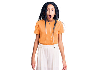 Cute african american girl wearing casual clothes afraid and shocked with surprise expression, fear and excited face.