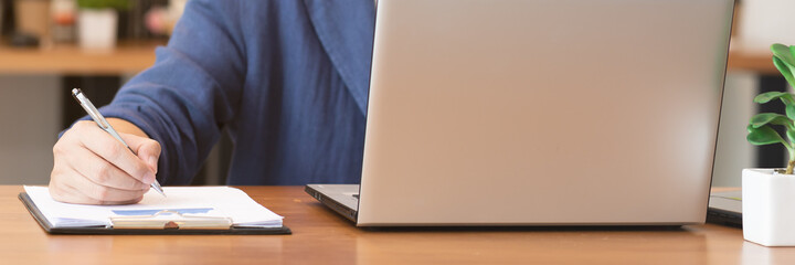 Close up hand business man note job  on graph in business meeting.