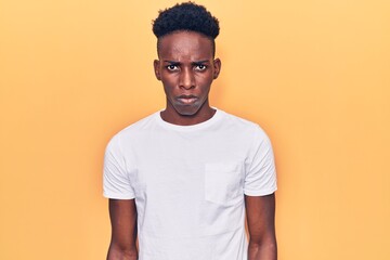 Young african american man wearing casual clothes depressed and worry for distress, crying angry and afraid. sad expression.