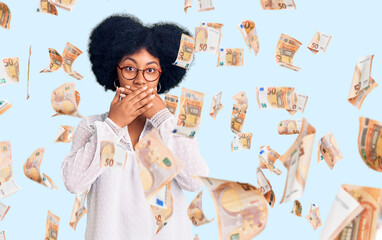 Young african american girl wearing casual clothes shocked covering mouth with hands for mistake....