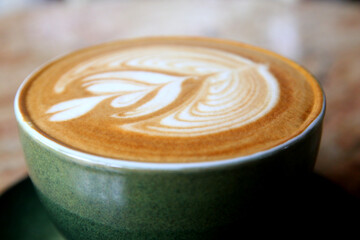 cup of hot latte art coffee