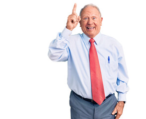 Senior handsome grey-haired man wearing elegant tie and shirt pointing finger up with successful idea. exited and happy. number one.