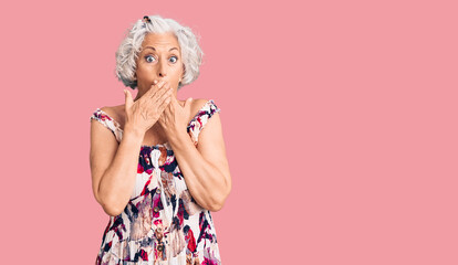 Senior grey-haired woman wearing casual clothes shocked covering mouth with hands for mistake. secret concept.