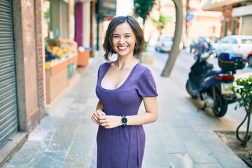 Young beautiful girl smiling happy walking at street of city