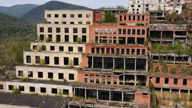 View from above. Khrustalnensky mining and processing plant. The camera flies past the destroyed buildings of a tin mining plant in Russia.