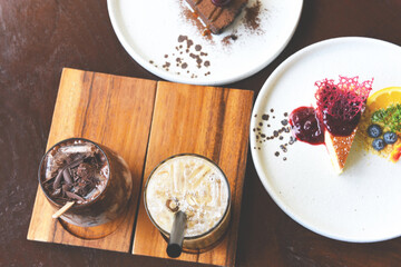 Cocoa drink chocolate and Bubble milk tea or Taiwan milk tea in glass on the wooden table with cake
