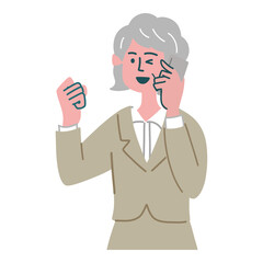 スーツ　女性　シニア　士業　携帯電話　スマホ　ガッツポーズ

