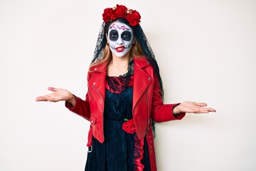 Woman wearing day of the dead costume over white clueless and confused with open arms, no idea concept.