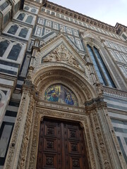 Piazza del Duomo in Florence, Italy. Cathedral of Santa Maria del Fiore entrance in detail. Florence architecture.