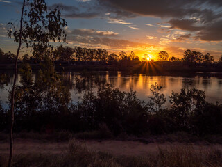 Beautiful Riverside Sunset with Reflections