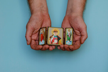 Christian icon of the holy princess Olga and the archangels Gabriel and Michael in their hands.