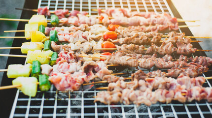 Delicious BBQ steaks grilled over charcoal.