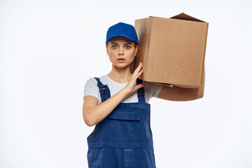 Woman working uniform box in hands packing service light background