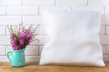 Pillow mockup with magenta wildflowers