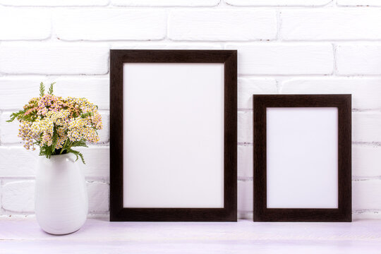 Two black poster frames mockup with pink yarrow © TasiPas