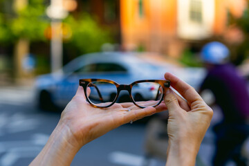 Glasses being held up outside