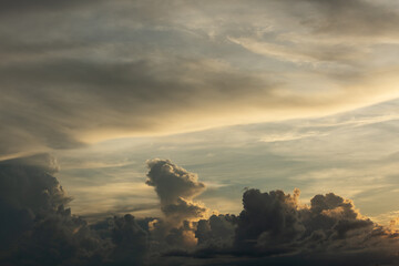 Beautiful sunset sky above clouds with dramatic light