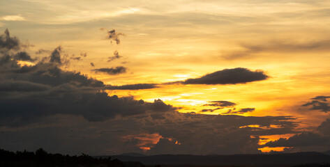 Beautiful sunset sky above clouds with dramatic light