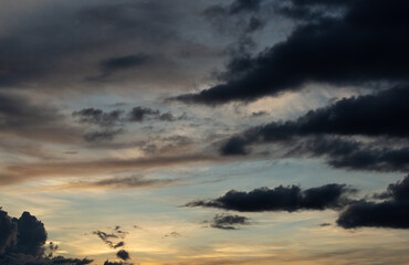 Beautiful sunset sky above clouds with dramatic light