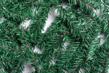 artificial Christmas tree leaf decorate on white wooden background