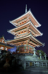 Fototapeta na wymiar The illuminated three-storied pagoda at night. Kiyomizu-dera (Otowa-san) temple. Kyoto. Japan