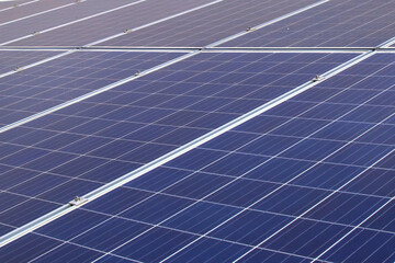 Close-up solar panels or solar roofs installed on the building rooftop.