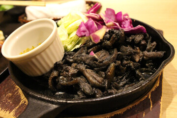 Black charcoal fried chicken at Japanese izakaya