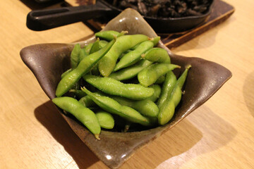Boiled edamame beans served at izakaya