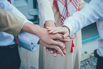 Hands close-up of arab engineer and businessman.