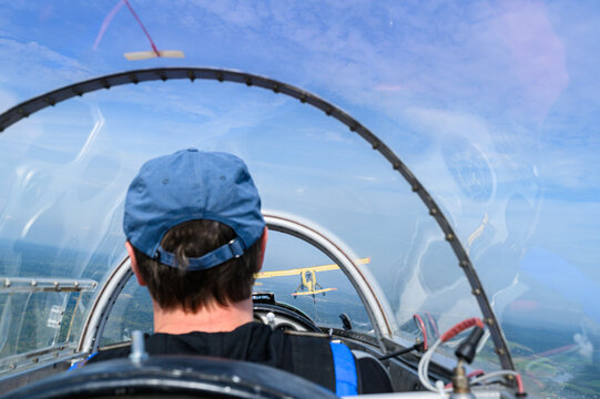 view in the cockpit behind the pilot during the flight