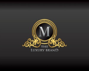 Gold Luxury Brand Letter M Elegant Logo Badge. Golden Letter Initial Crest, Wreath and Crown Monogram Design Vector.