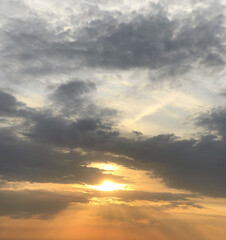 Sun light on cloudy sunset sky