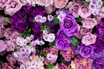 Closeup image of beautiful flowers wall background with amazing colorful roses. Top view