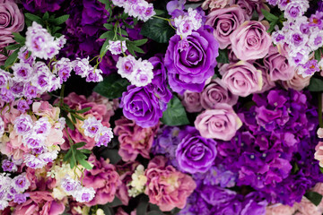 Closeup image of beautiful flowers wall background with amazing colorful roses. Top view