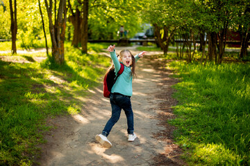 
cheerful child with a backpack