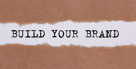 build your brand written under torn paper on white background