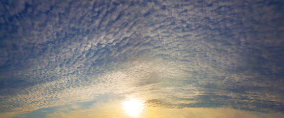 Sun on nightly sky. Sunset sky with clouds