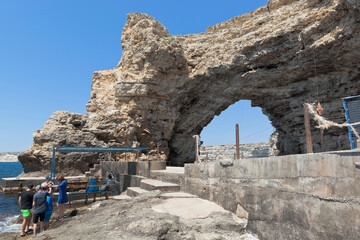 Fototapeta na wymiar Arch of Cape Big Atlesh - the main symbol of Tarkhankut, Crimea