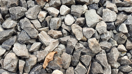 Granite gravel road texture. Natural crushed stone background. Grey  copy space surface with granite, gravel or rock