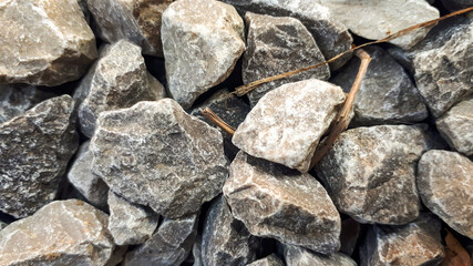 Granite gravel road texture. Natural crushed stone background. Grey  copy space surface with granite, gravel or rock