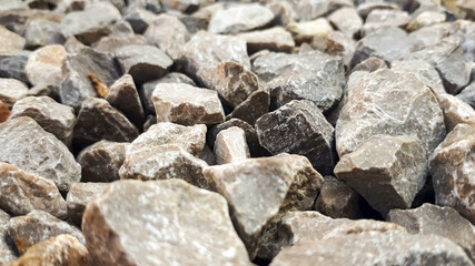 Granite gravel road texture. Natural crushed stone background. Grey  copy space surface with granite, gravel or rock
