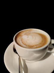 A cup of Coffee with black background.