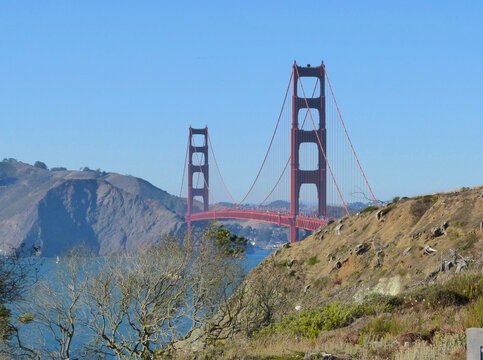 Golden Gate Bridge in San Francisco, California - beautiful perspective with hills and blue sky