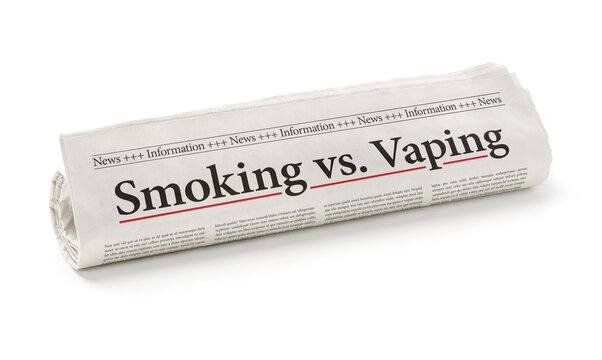 Rolled newspaper with the headline Smoking vs. vaping